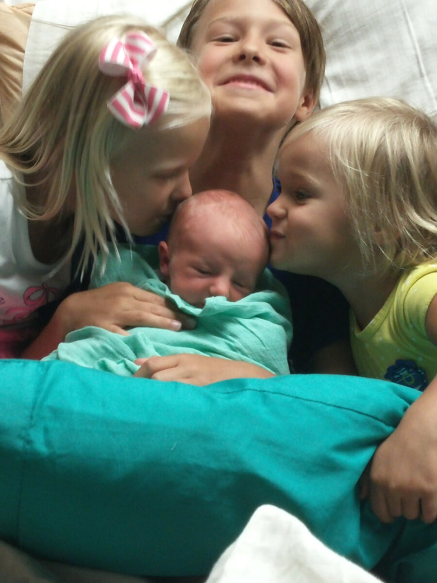 Katy's children meeting a newborn
