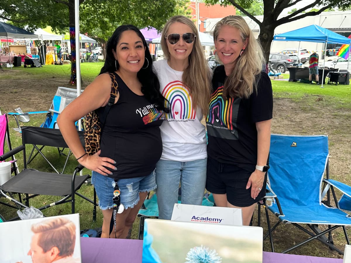 Katy and teammates at a community outreach booth